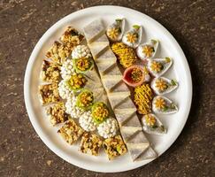 Indian Traditional Mix Sweets Food Served in Special Decorative Plate on Vintage Background photo