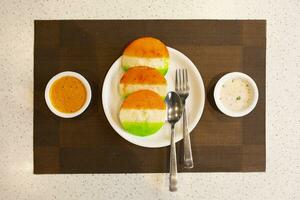 South Indian Popular Breakfast Idli Served With Sambar And Coconut Chutney Also Know as Idly photo