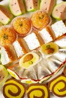 Indian Traditional Mix Sweets Food Served in Special Decorative Plate on Vintage Background photo