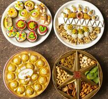 Indian Traditional Mix Sweets Food Served in Special Decorative Plate on Vintage Background photo