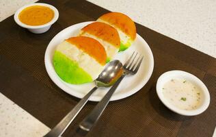 South Indian Popular Breakfast Idli Served With Sambar And Coconut Chutney Also Know as Idly photo