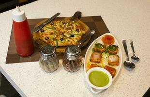 Indian Starter Dish Paneer Tikka Kabab or Paneer Cubes With Capsicum Pizza photo