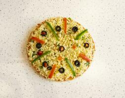 Vegetarian Delicious Capsicum Pizza Made From Capsicum, Cheese, Tomatoes, Peppers, Onions And Olives photo