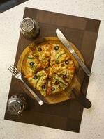 Vegetarian Delicious Capsicum Pizza Made From Capsicum, Cheese, Tomatoes, Peppers, Onions And Olives photo