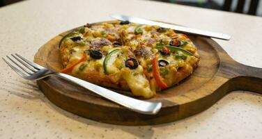 Vegetarian Delicious Capsicum Pizza Made From Capsicum, Cheese, Tomatoes, Peppers, Onions And Olives photo