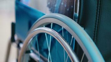 Following shot of elderly woman in wheelchair. Moving through the hallway. Disabled disability handicapped impairment disease treatment and patient paralysis photo