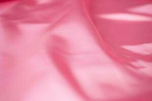 Modern bright pink fabric stripes blurred background photo