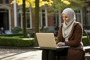 AI generated Muslim woman in hijab working on laptop photo