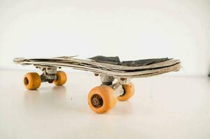 a skateboard made of old wood with wheels photo