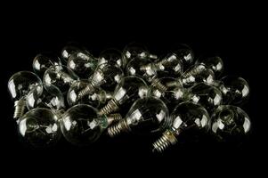 a pile of small glass bulbs on a black background photo