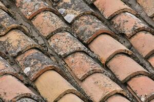 a close up of a roof with many different types of tiles photo