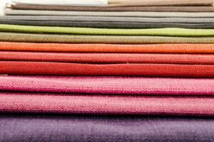 a stack of colorful fabric on a table photo