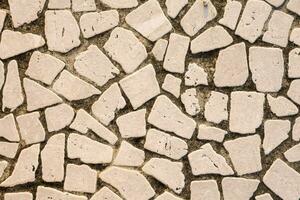 a close up of a white stone wall photo