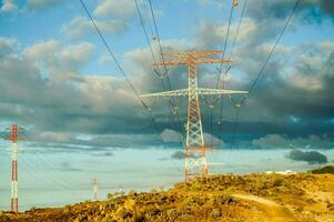 electricity pylons in the desert photo