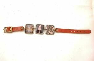 a bracelet with three pictures photo