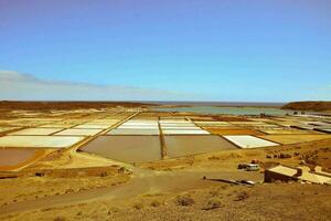 the salt fields near the ocean photo