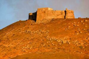 the castle on the hill at sunset photo