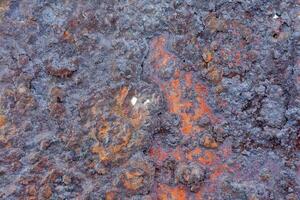 a close up of a rusty metal surface photo