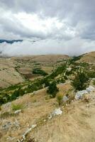 the ruins of an old castle in the mountains photo