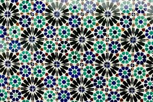 a colorful tile pattern with blue, green and red flowers photo