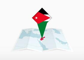 Jordan is depicted on a folded paper map and pinned location marker with flag of Jordan. vector