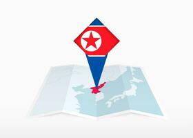 North Korea is depicted on a folded paper map and pinned location marker with flag of North Korea. vector