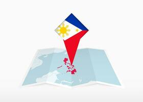 Filipinas es representado en un doblada papel mapa y clavado ubicación marcador con bandera de filipinas vector