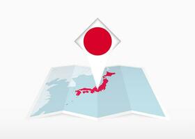 Japón es representado en un doblada papel mapa y clavado ubicación marcador con bandera de Japón. vector