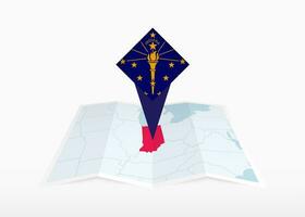 Indiana is depicted on a folded paper map and pinned location marker with flag of Indiana. vector