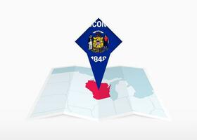 Wisconsin is depicted on a folded paper map and pinned location marker with flag of Wisconsin. vector