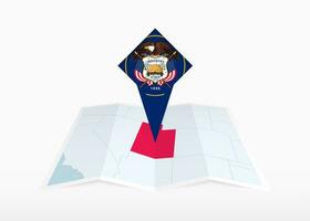 Utah is depicted on a folded paper map and pinned location marker with flag of Utah. vector