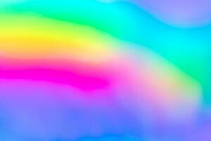 Abstract blur holographic rainbow foil iridescent background photo