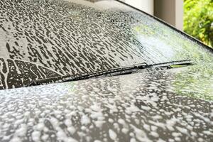 car cleaning and washing with foam soap photo