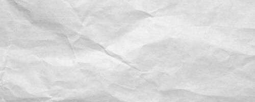 Abstract white crumpled and creased recycle craft paper texture background photo