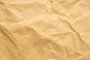 Abstract crumpled and creased recycle brown paper texture background photo