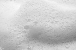 Abstract white soap foam bubbles texture background photo