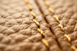 luxury brown leather bag texture background with stitching photo