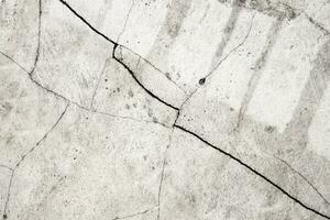 Grunge cracked concrete wall texture abstract background photo