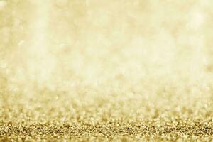 Abstract gold glitter sparkle blurred with bokeh background photo