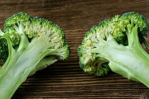 Fresh broccoli on the wooden table photo