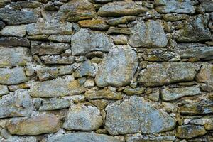 Stone wall. Outdoor background natural stone photo