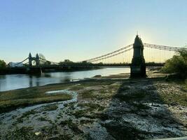 A view of the River Thames at Hammersmith showing the bridge photo