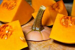 Butternut cut into pieces, squash slices with seeds, cucurbita moschata photo