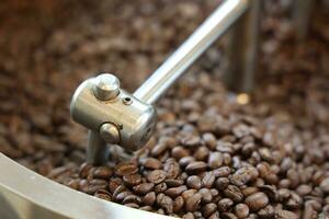 Coffee grinder and coffee beans, closeup of photo