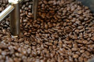 Coffee grinder and coffee beans, closeup of photo