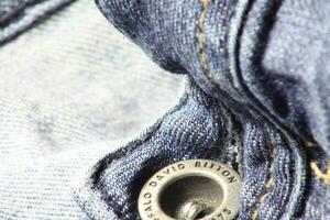 Close-up of blue jeans and denim details. photo