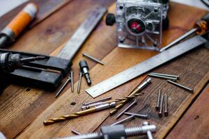 Collection of woodworking tools on a wooden background. photo