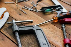 Collection of woodworking tools on a wooden background. photo