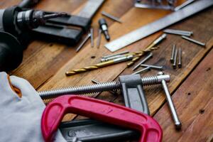 Collection of woodworking tools on a wooden background. photo