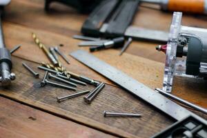 Collection of woodworking tools on a wooden background. photo